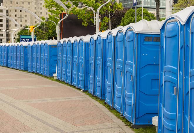 a row of portable restrooms for a special event, ensuring guests have access to clean facilities in Ballico